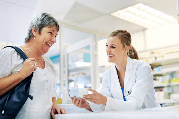 dispensing best treatment advice shot young pharmacist assisting customer 1